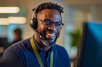 Happy African man using the best CRM for telemarketing to improve outbount calling performance.